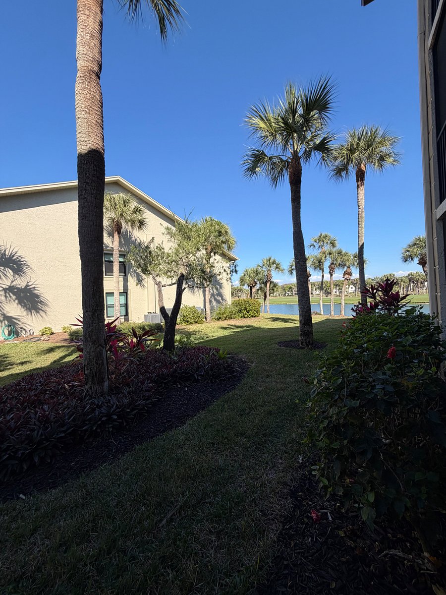 Side view from the lanai. Faces golf course water feature and the side of adjacent manor. Very private with NO lanais facing yours.