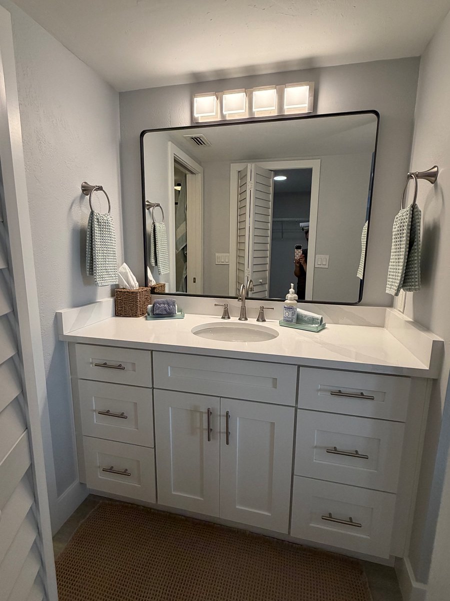 Spacious and well-lit primary bath vanity.