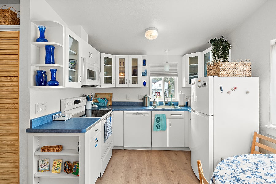 Fully appointed kitchen with full sets of dishes, glass ware, utensils, bowls, blender, toaster oven, coffee maker, pots, pans, baking sheets, etc.