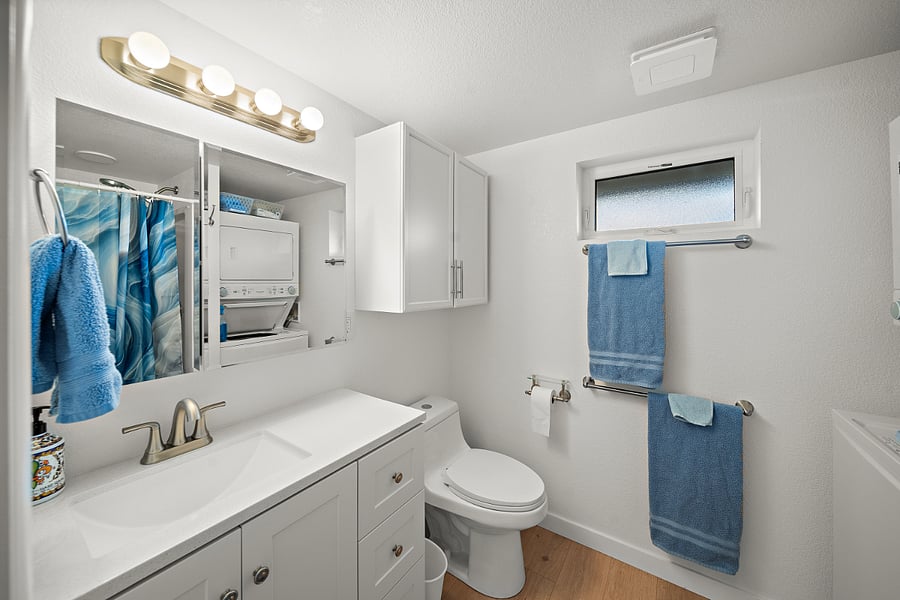 Bathroom with storage and full size shower stall.