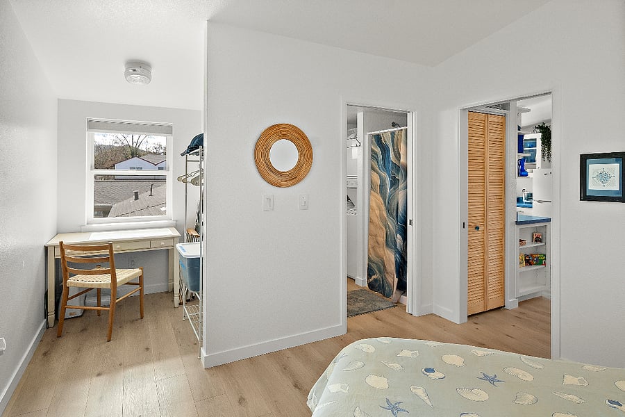 Bedroom with desk nook and storage. Pocket door for bedroom privacy.