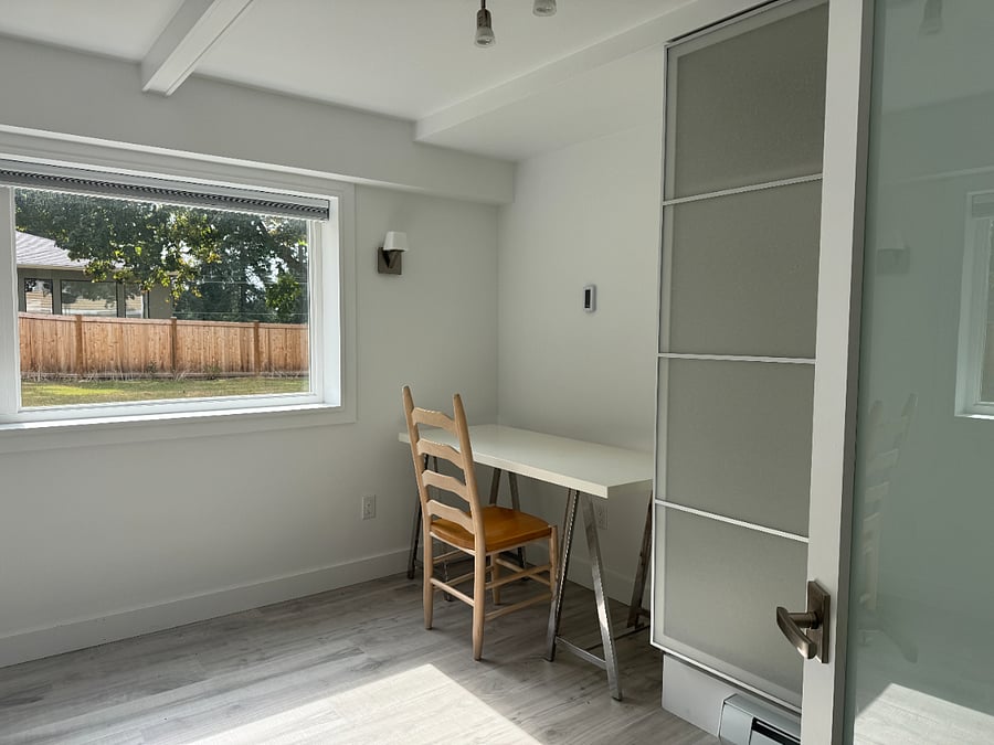 Desk with sconce above for indirect light. IKEA Pax wardrobe, if a bed is added for more sleeping capacity.