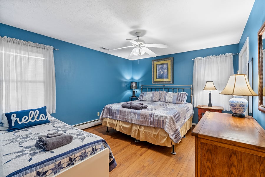 Bedroom with king bed and single twin, closet, chest of drawers. Linens and towels provided