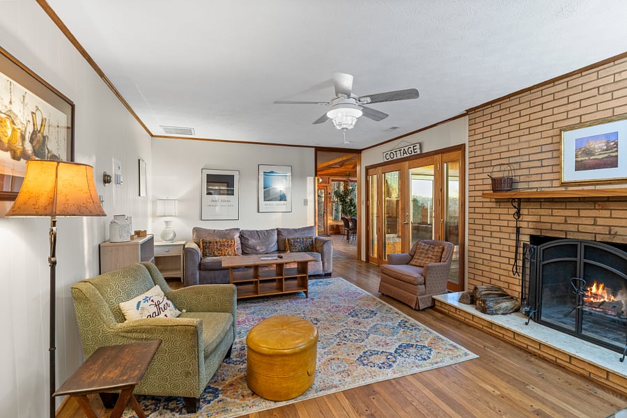 Cozy living area with Roku TV, doors to back patio/deck. Fireplace is not usable.