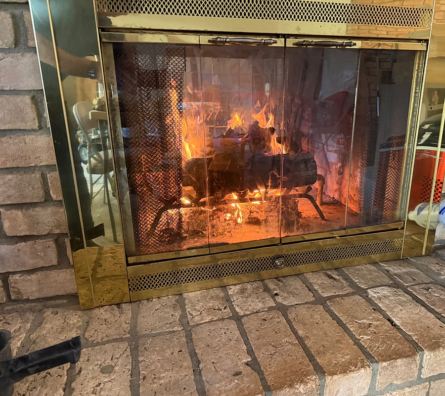 Wood Burning Fireplace with gas fire assistance. Open on both sides to both living areas.