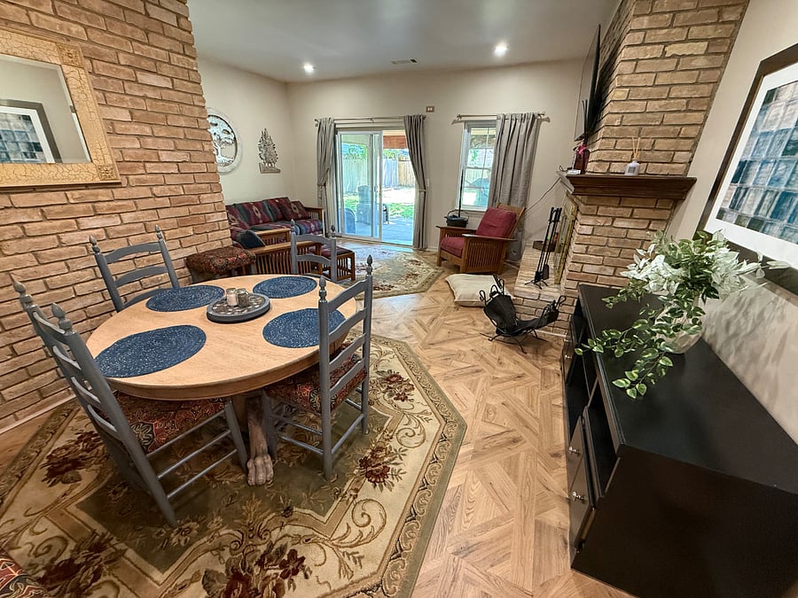Open Dining and Family Room with wood Bruning Fireplace.