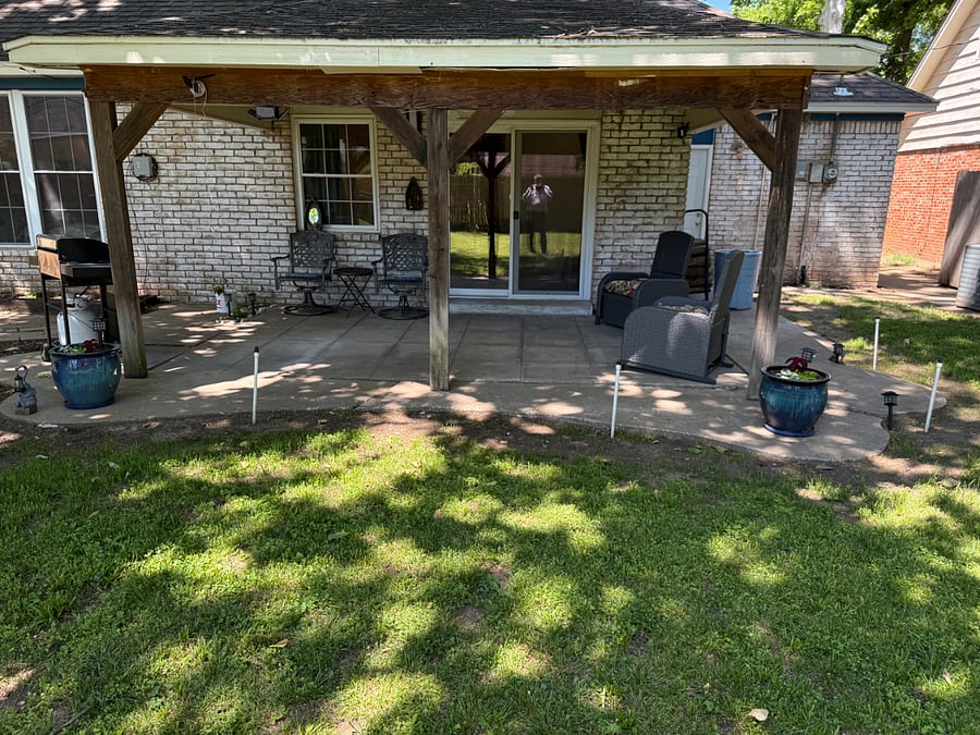 Cocered Back Porch, with Outdoor Furniture and Propane Gas Grill.