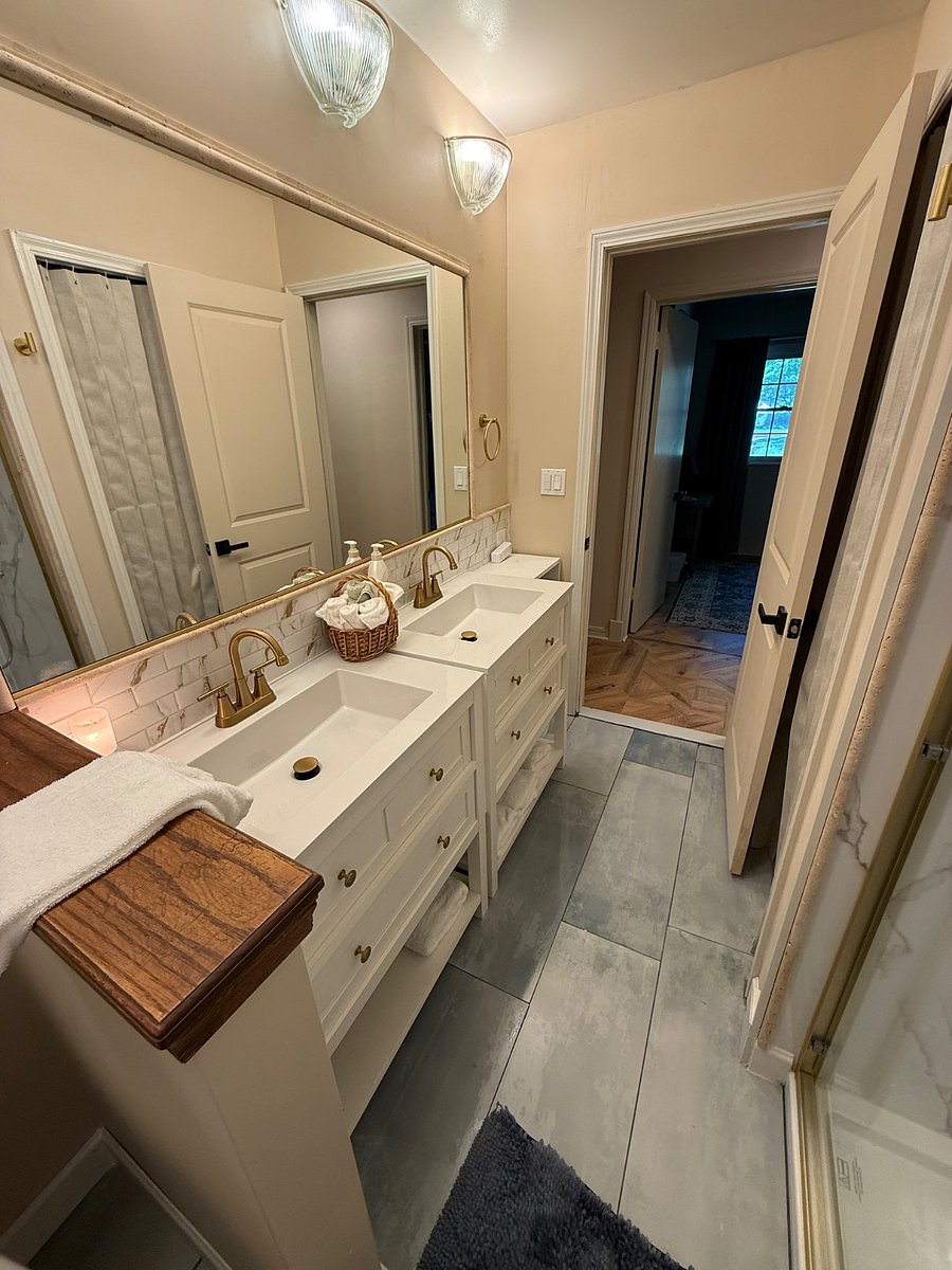 Main Bathroom, All New tiled flooring, Shower, double sinks and toilet.