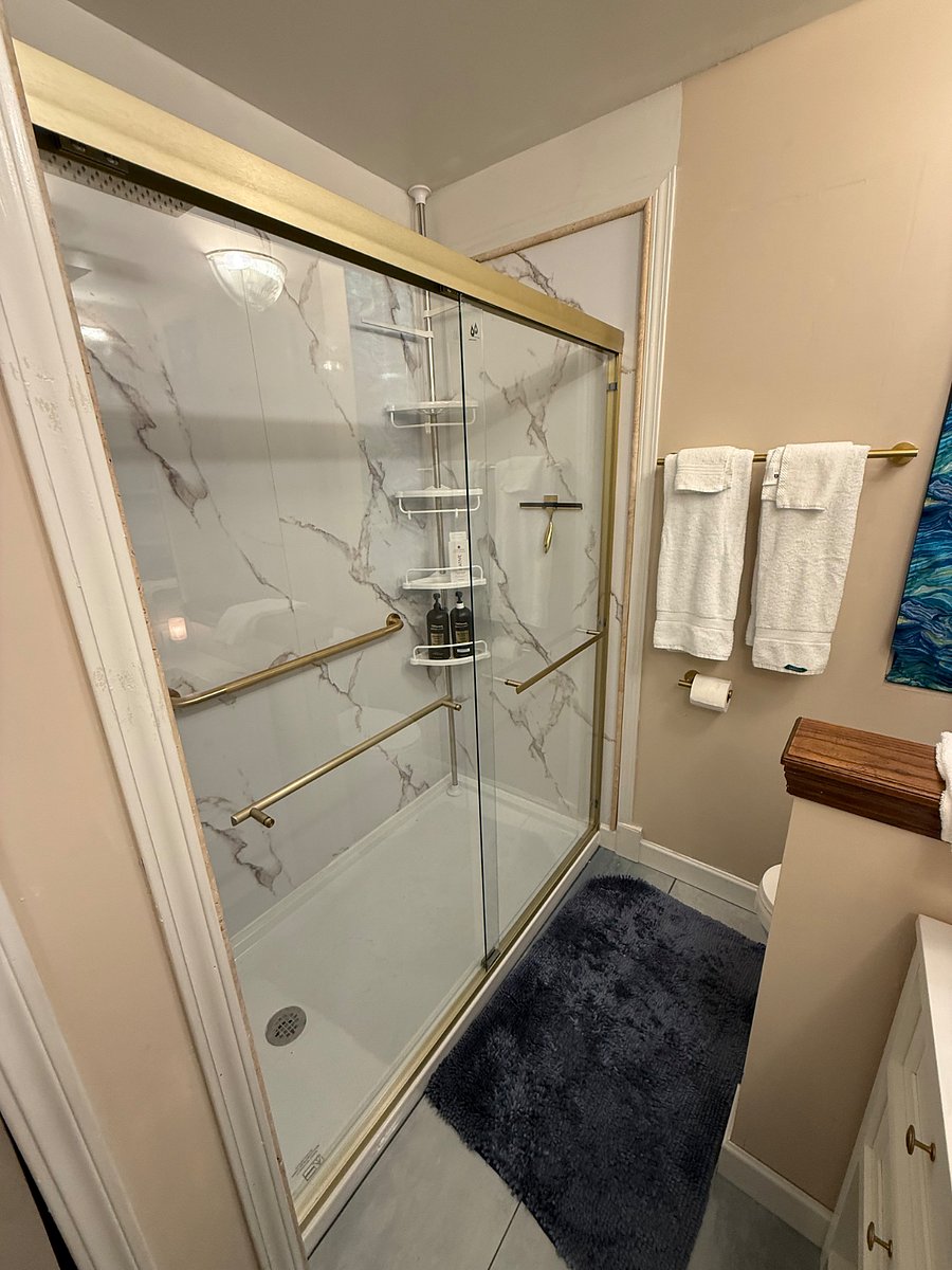 Main Bathroom, All New tiled flooring, Shower, double sinks and toilet.