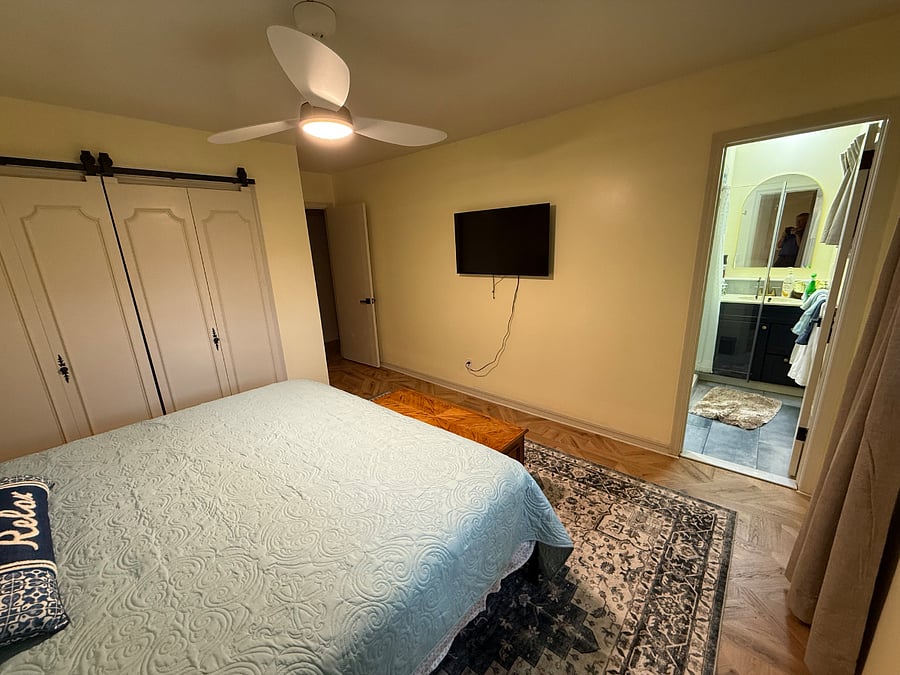 Primary Bedroom with King Bed, smart TV, private bath, large closet.