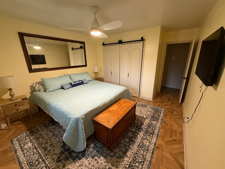 Primary Bedroom with King Bed, smart TV, private bath, large closet.