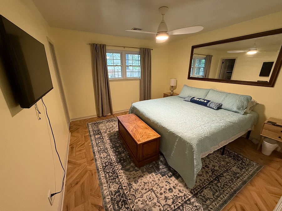 Primary Bedroom with King Bed, smart TV, private bath, large closet.