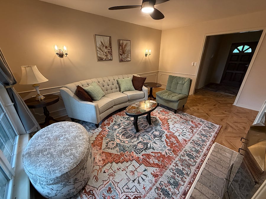 Formal Living Room, Woodburning Fireplace shares with Fmaily room. Great place for quite, study, or work.