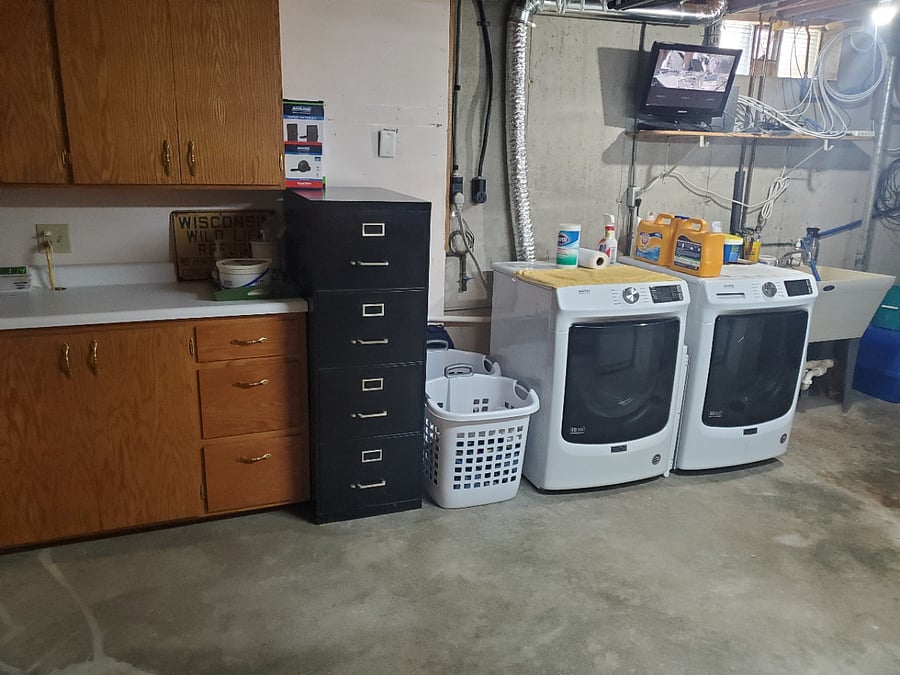 You have full access to the laundry facilities, which are adjacent to the basement den area.