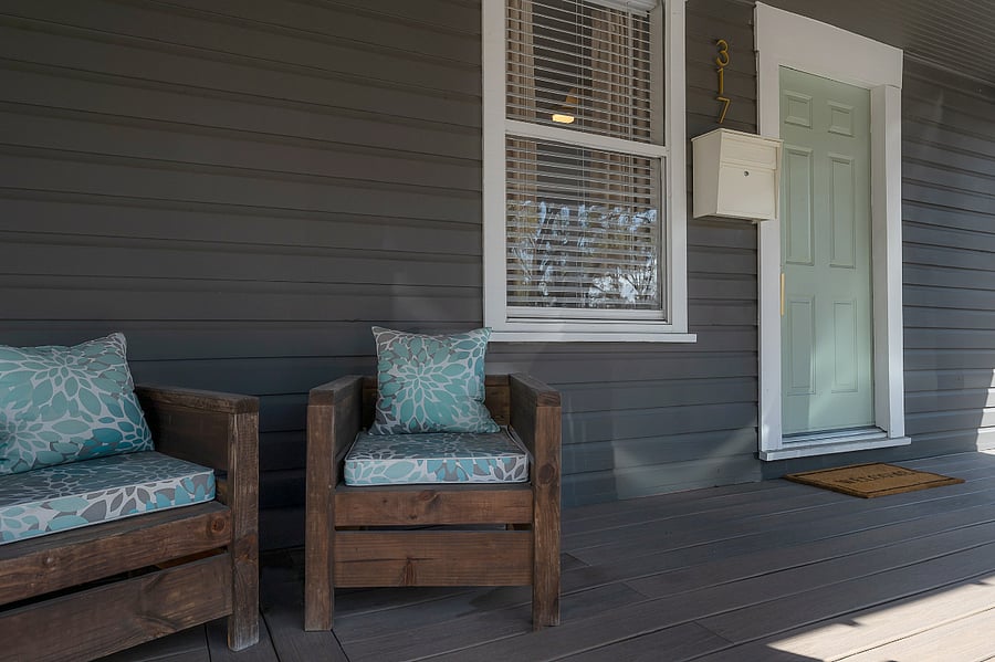 Front porch with chairs, mailbox for this unit, and private entry.