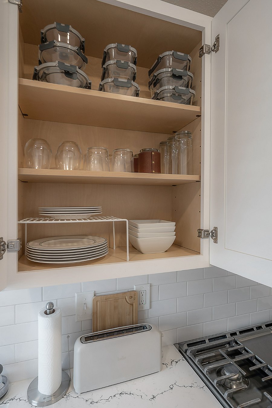 Fully stocked kitchen with dishes, utensils, pots, pans