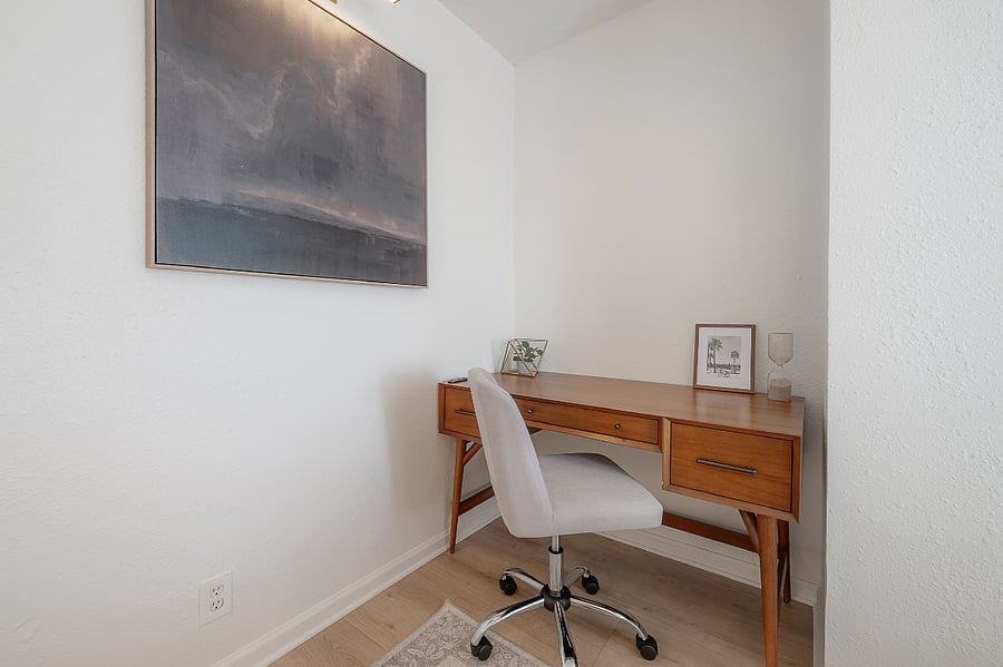 Guest bedroom with full sized bed, closet, and West Elm desk and office chair