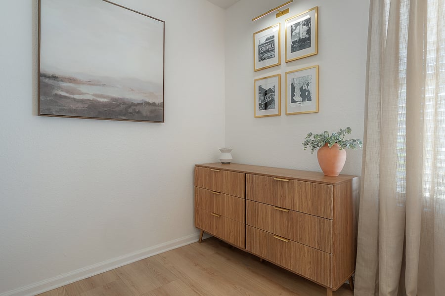 Primary bedroom at the back of the house with dresser