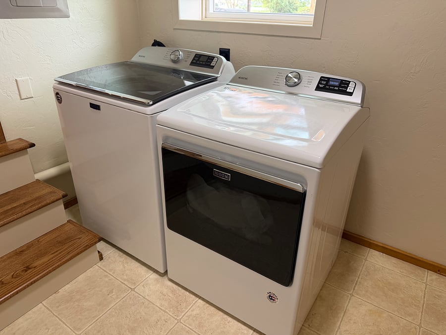 Maytag top-load washer and front load dryer.