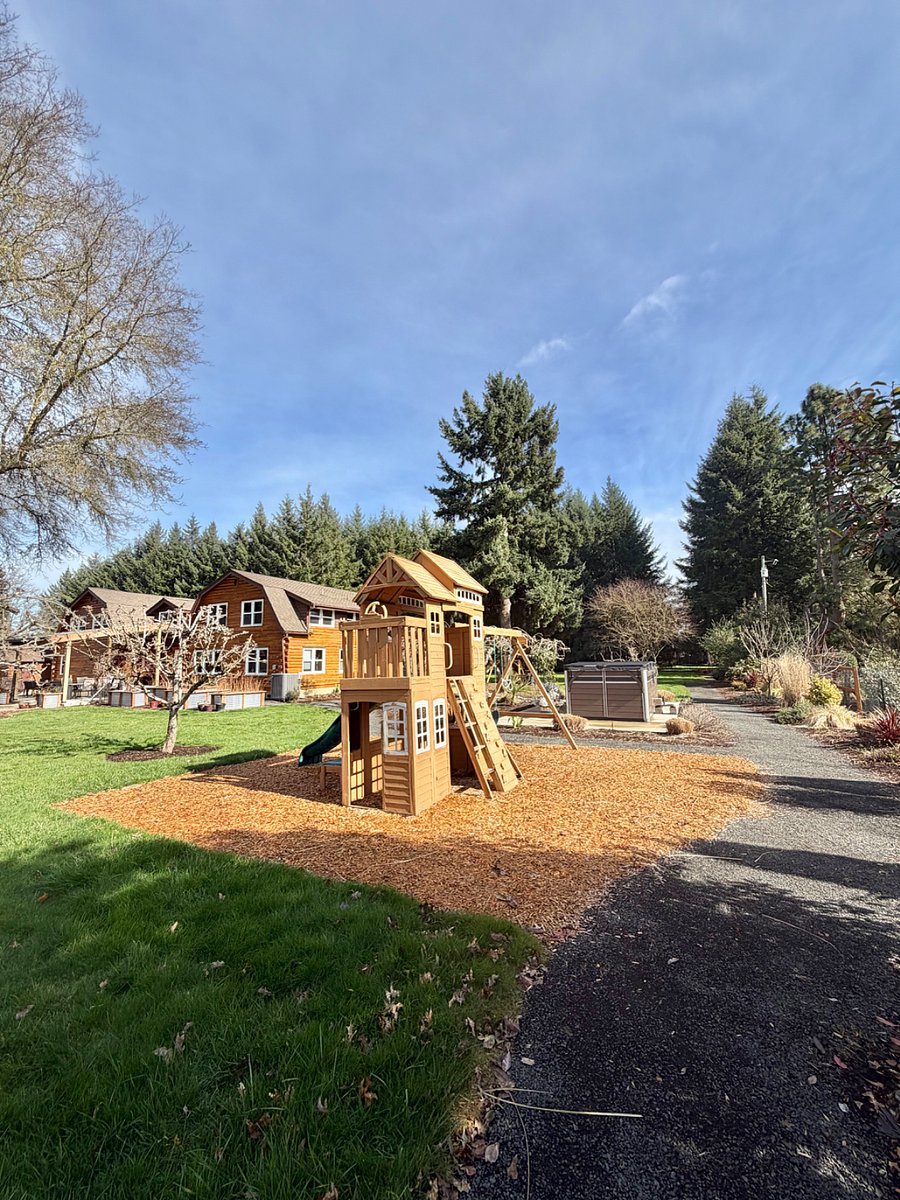 Walking path (part of which is pictured here) gently meanders around the property for serene walks or more vigorous running workouts.