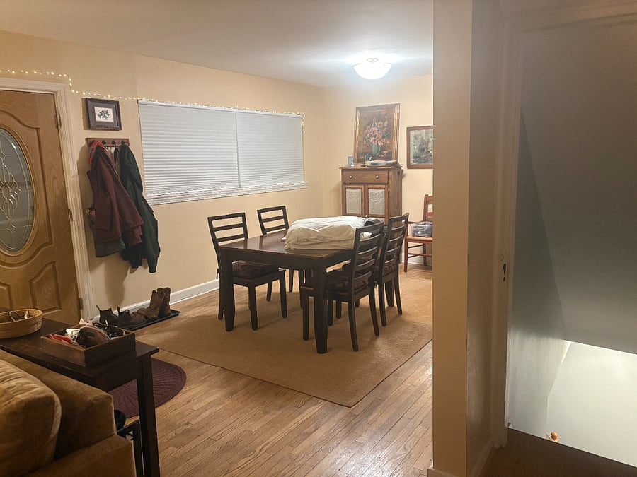 This is a view of the front entrance. The door opens on to the dining area, sitting room and kitchen on main floor.