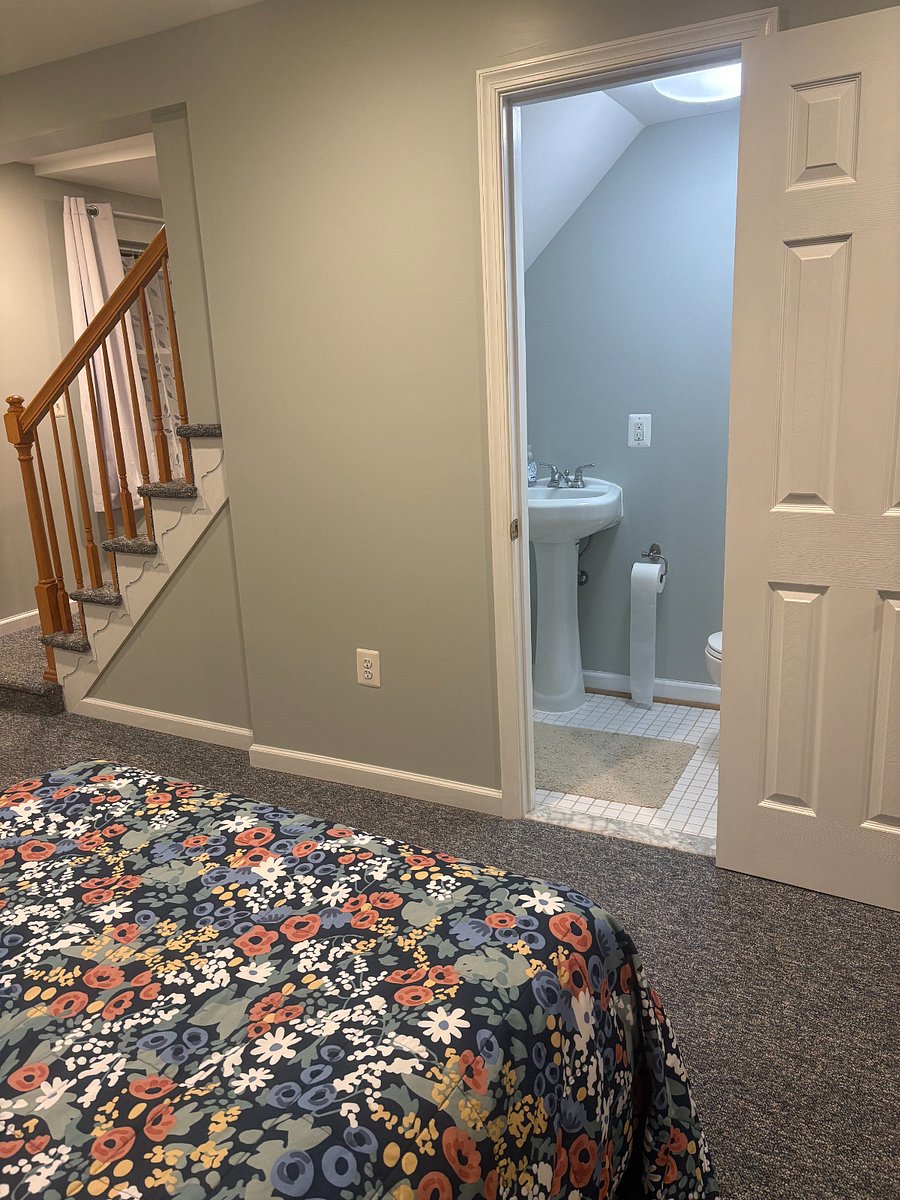 View from the bed of the stairs and the powder room.