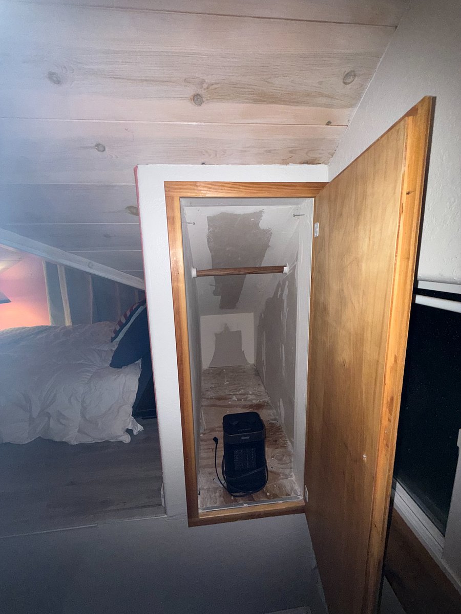 small closet behind bed area. Space heater as well