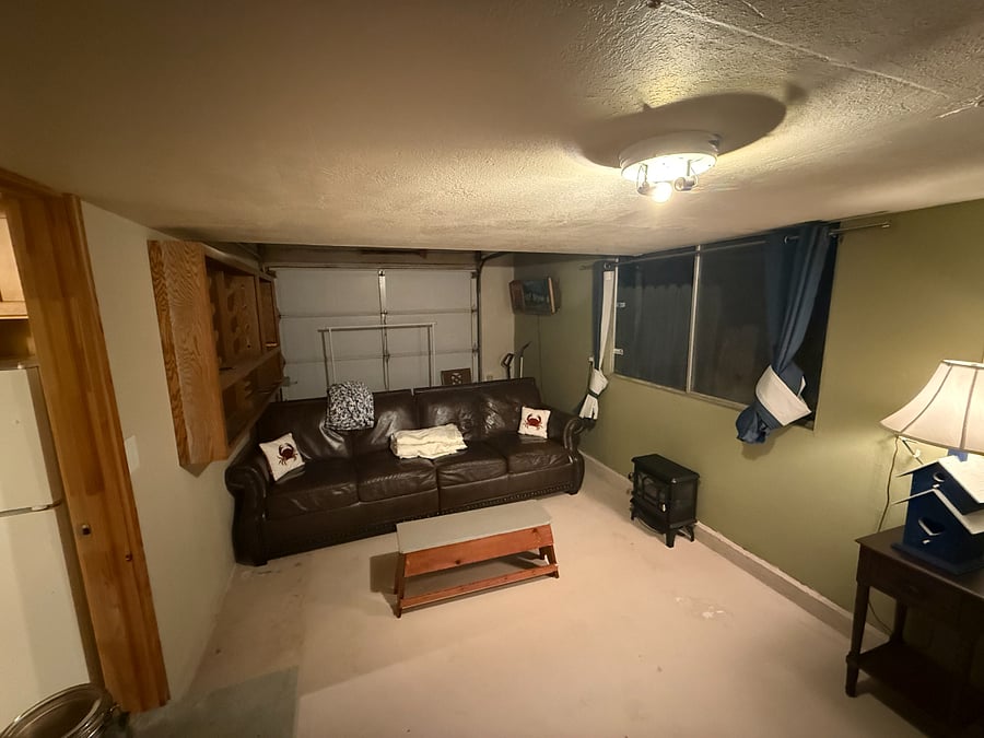 Living room, blackout curtains, TV, dresser, storage