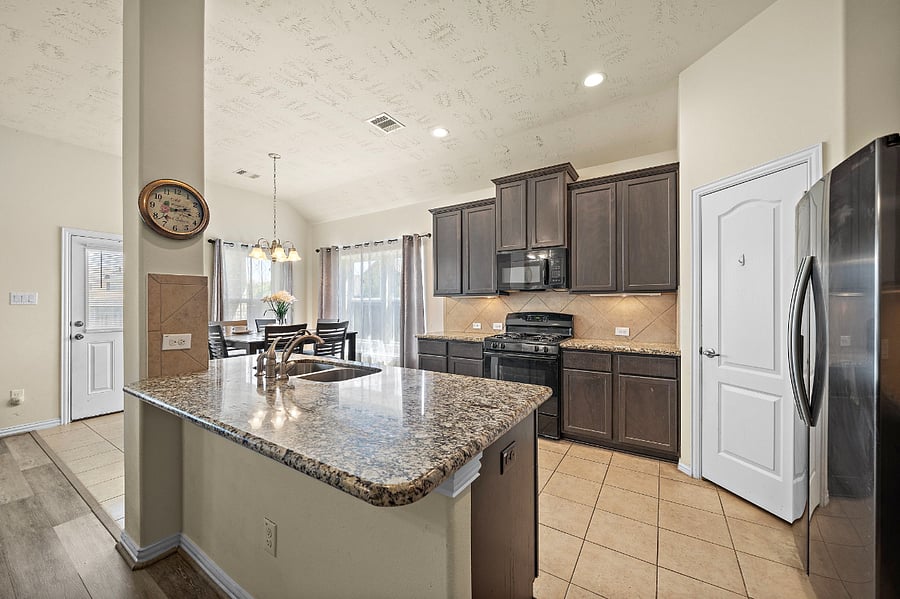 Kitchen with spaceous pantry.