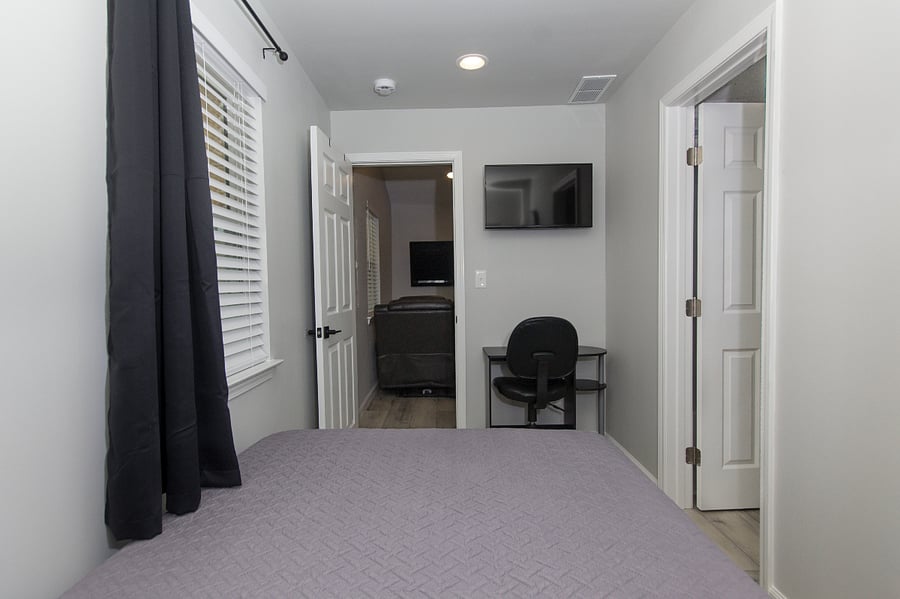 Dedicated workspace with desk and chair.