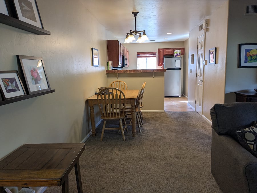 There's plenty of space to move the dining table out to accommodate guests.