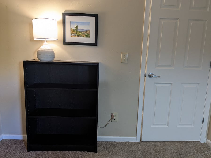 Shelf and second lamp in the second bedroom.