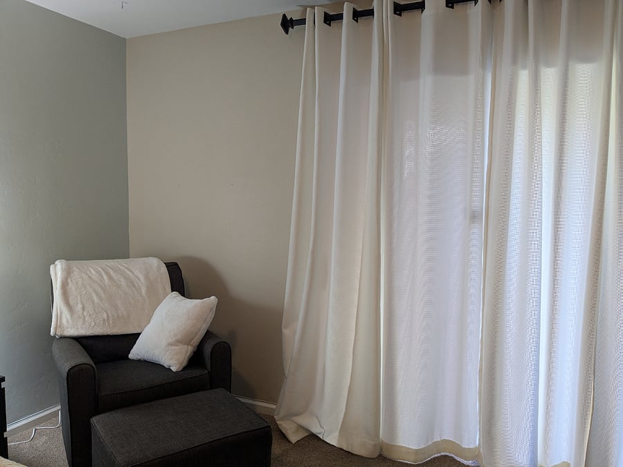Heavy curtains over the slider in the primary bedroom.
