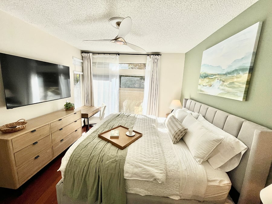 Unwind and watch your favorite shows from the comfort of bed on the 65" Vizio Smart TV, stay organized with the spacious dresser, and work in comfort at the dedicated workstation. The workspace features a roomy desk with ample table space, a desk light, convenient outlet for your laptop and electronics, a comfy chair, and a refreshing outdoor view perfect for remote work or trip planning.