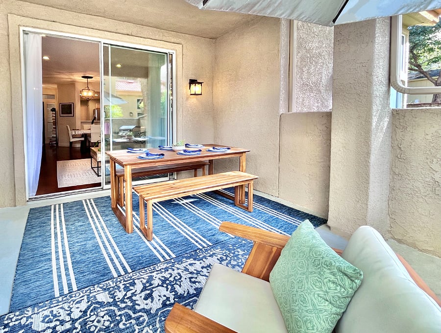 Step directly from the living room into the stylish outdoor dining area for six, offering an elegant space to savor meals and create memorable moments.