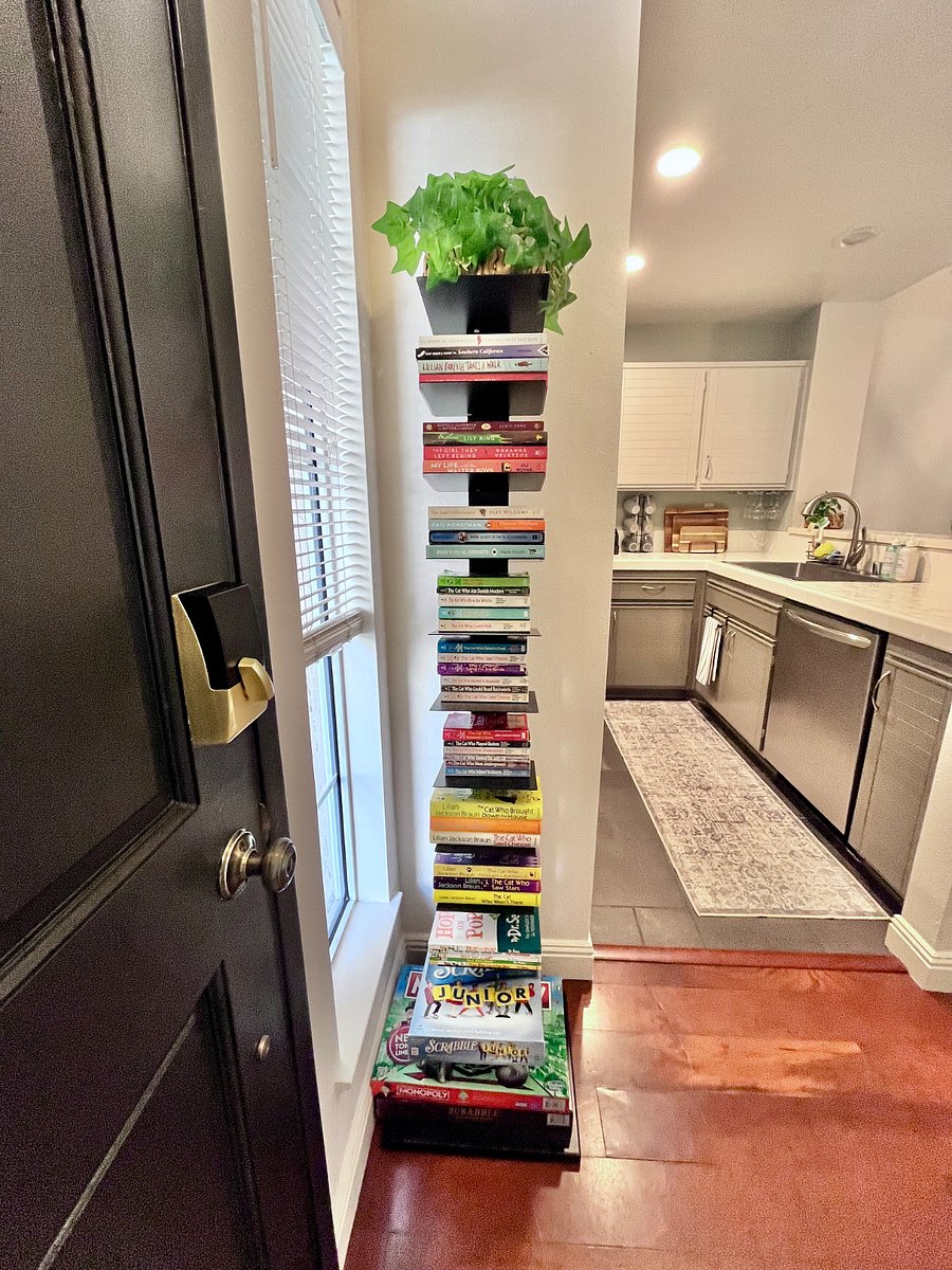 Thoughtfully curated mini library with bestsellers, travel guides, childrens classics, and popular board games plus junior editions for family fun and relaxation.
