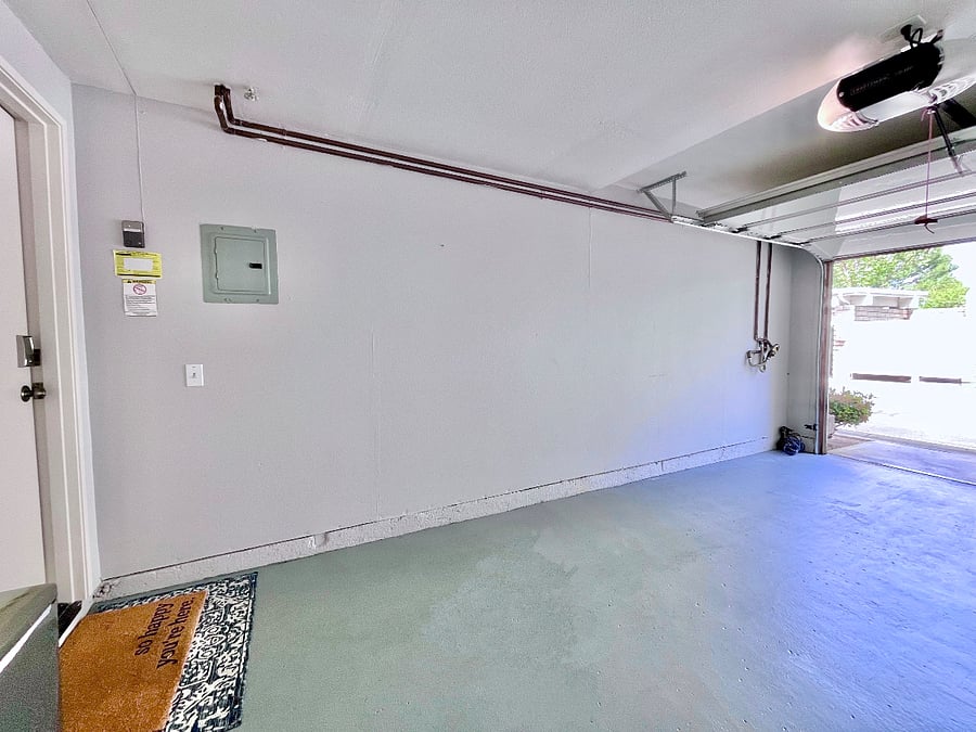 Convenient, easy access from the attached garage with remote-operated entry. Assigned carport is only a few steps across from it.