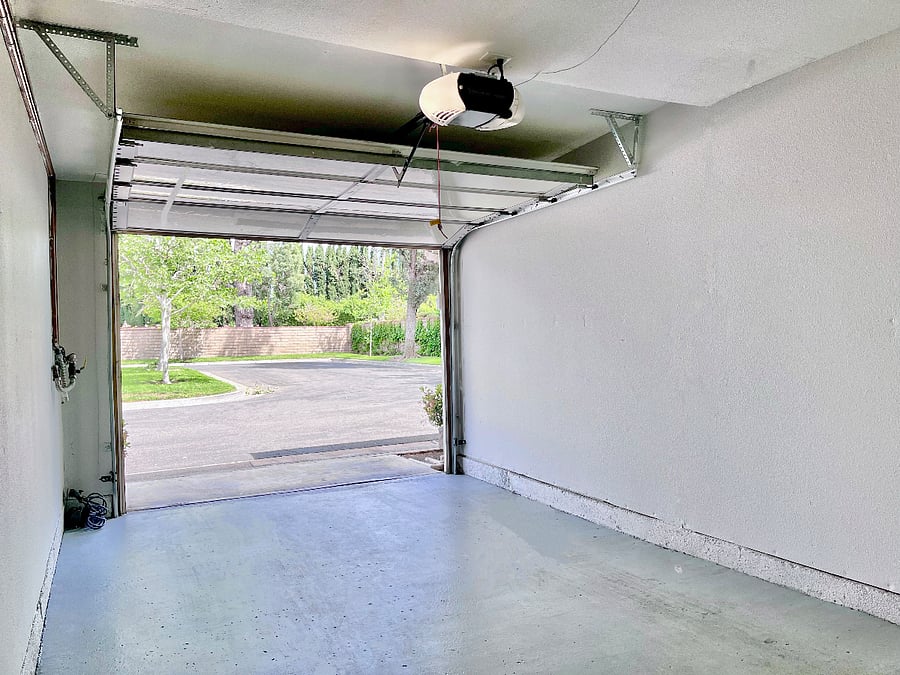 Across from attached garage and next to assigned carport are a free doggy bag station and extensive landscaped curbing, ideal for convenient pet walks and easy cleanup.