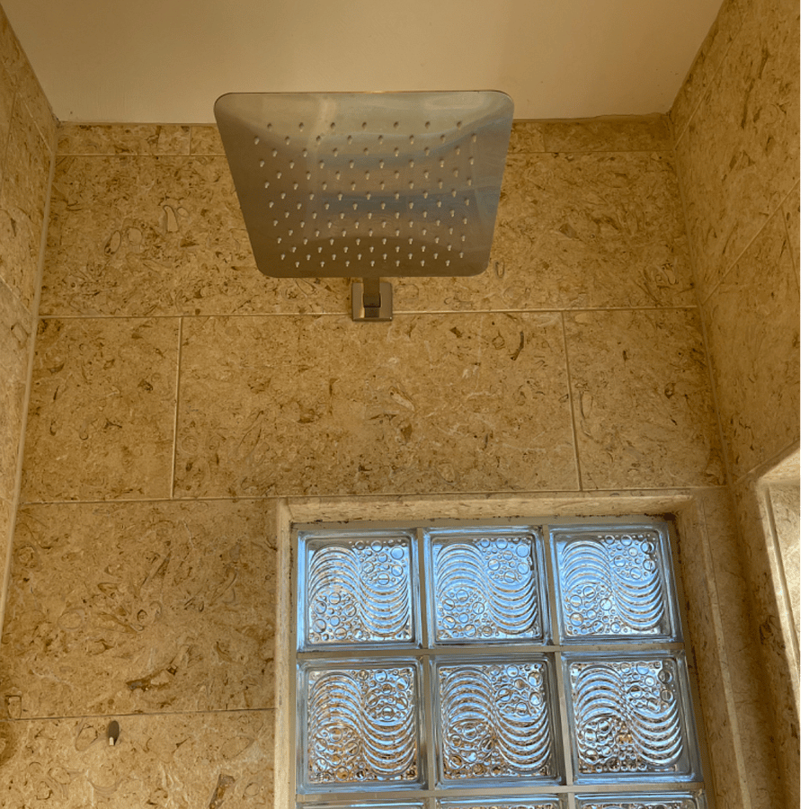 Rain shower head with additional hand sprayer.