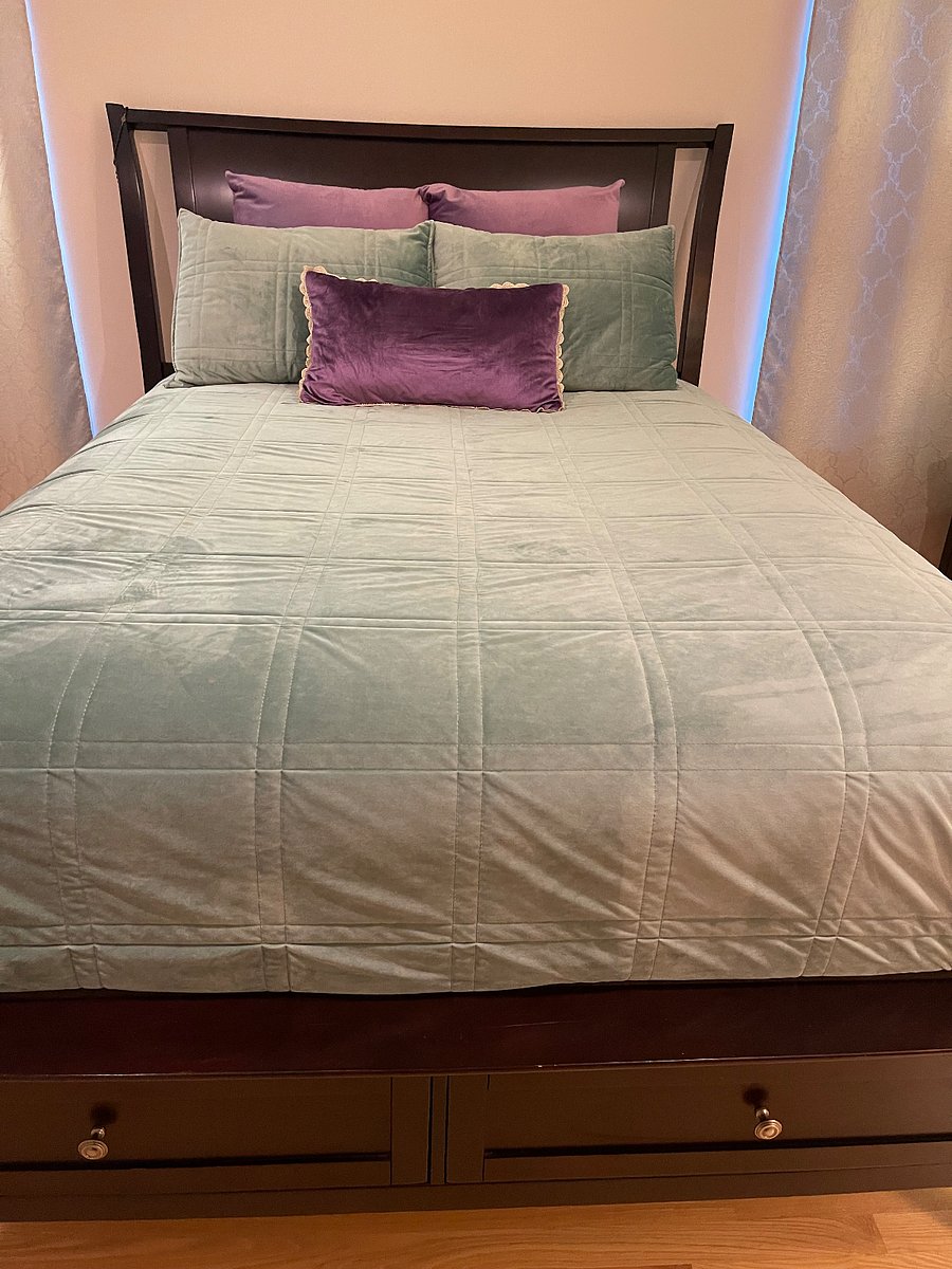 Queen bed with premium linens.