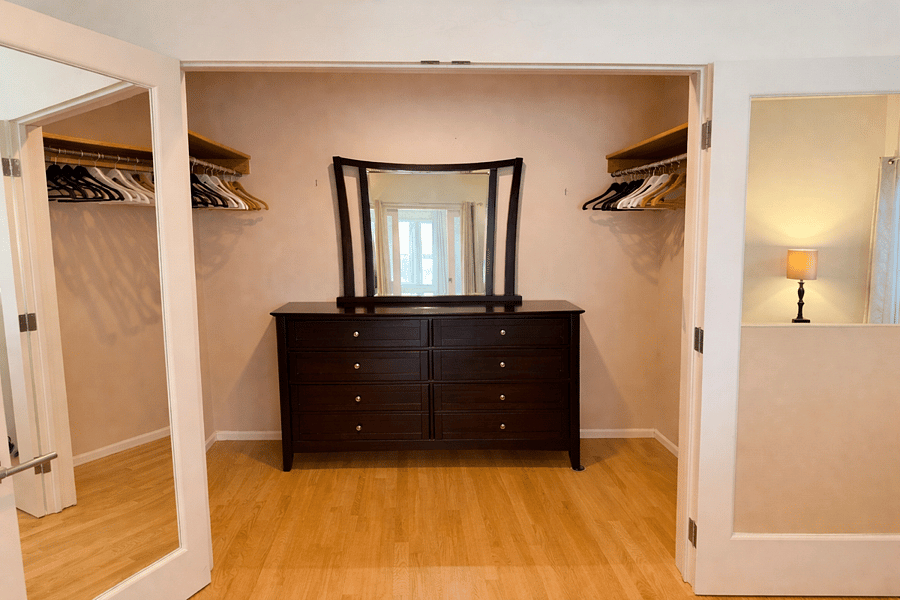 Generous walk-in closet with boutique style storage (8' x 9')
