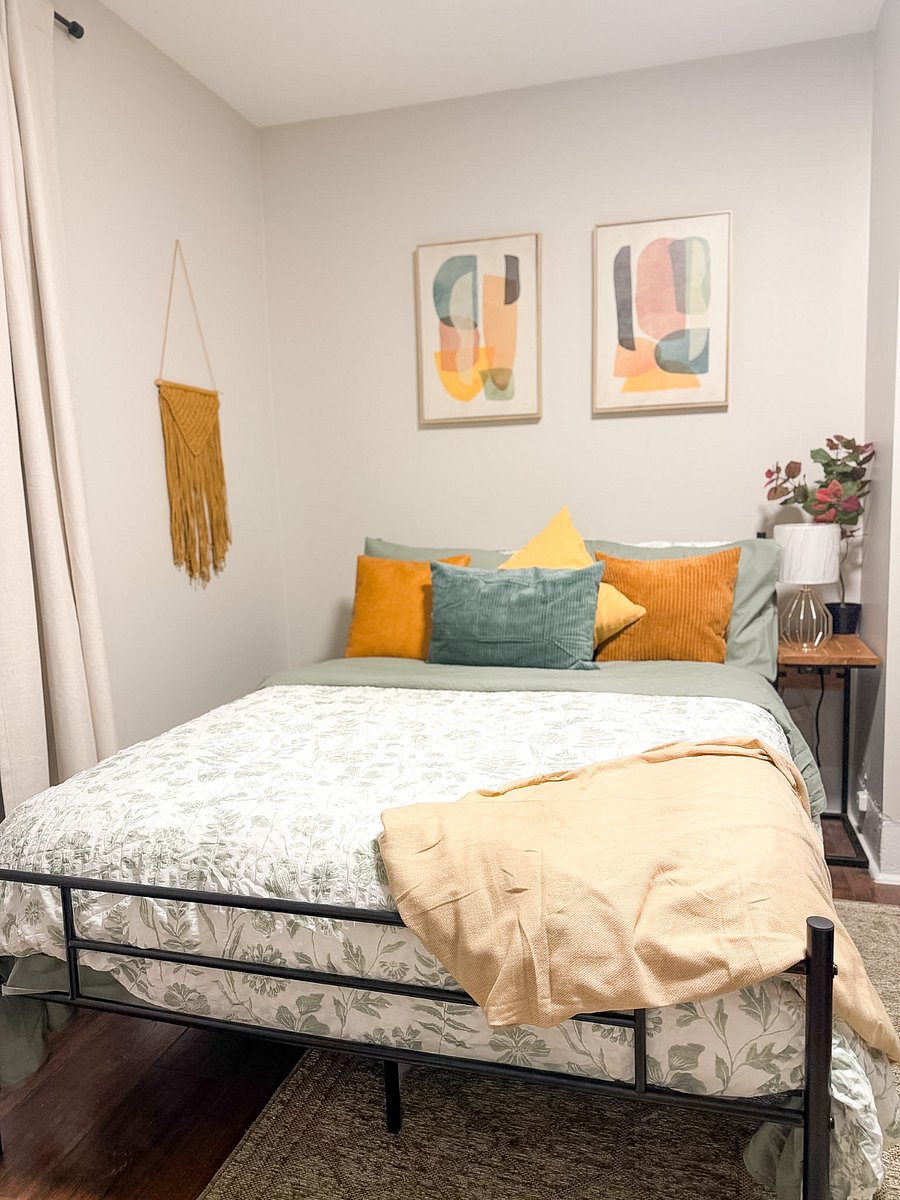 Guest bedroom with a cozy bed and nightstands with convenient charging stations.