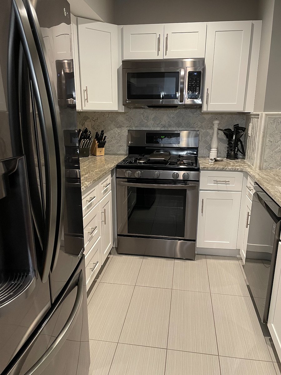 Kitchen with granite countertops and black stainless steel appliances