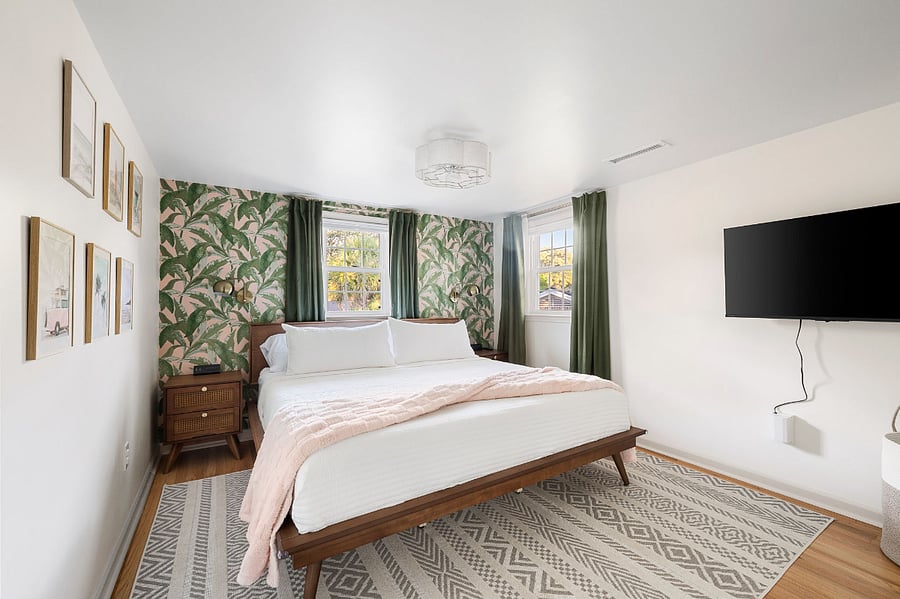 The upstairs king bed suite offers a full closet, smart tv, blackout shades and curtains, sound machine and ceiling and tower fan.