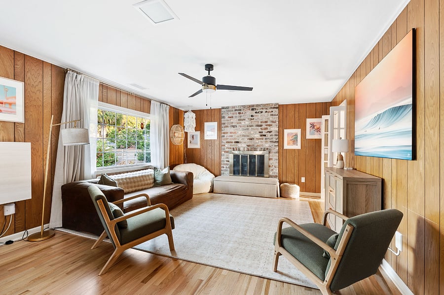 Right off the kitchen, there is a den with comfortable seating, a rug that is actually a children's play mat, a cozy reading corner and some toys provided for kiddos to have some entertainment during your stay.
