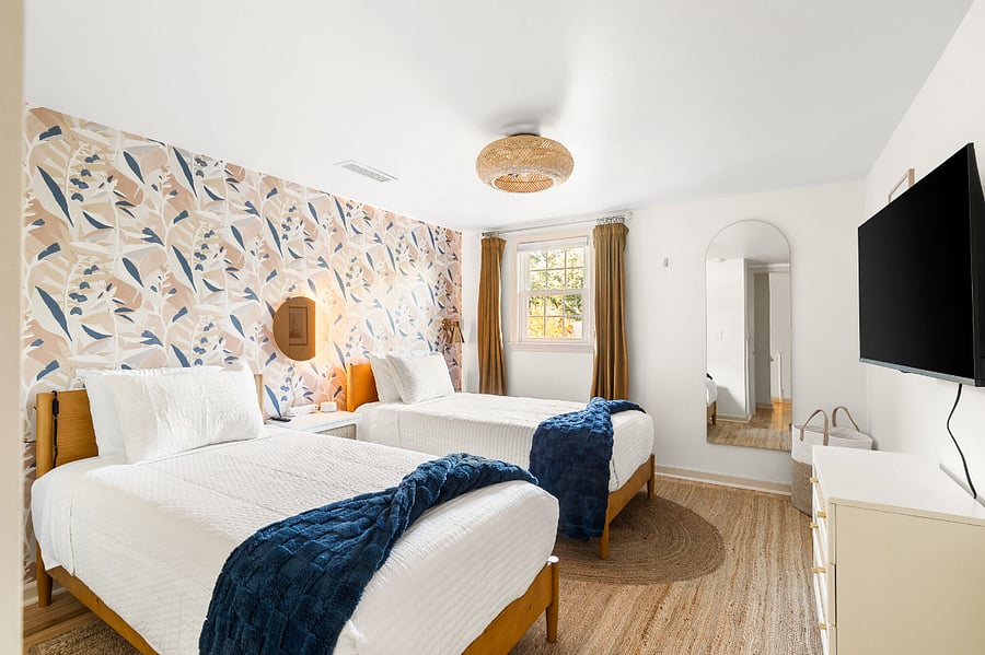 Upstairs twin beds for adding functional sleeping options for any group size. Room includes full sized closet, smart tv, blackout shades and curtain, ceiling fan and tower fan and sound machine.