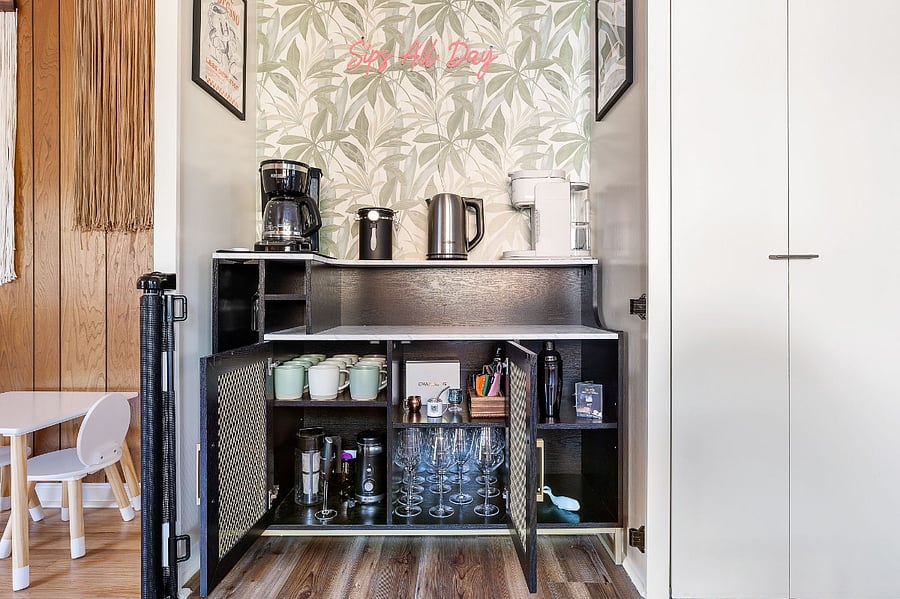 Full Coffee & Cocktail Bar! Equipped with drip coffee, Keurig, coffee grounds, a hot water kettle, and cold brew maker, a bean grinder, mugs, wine glasses, and a cocktail mixing set. 3 Keurig pods are provided as well as reusable ones!