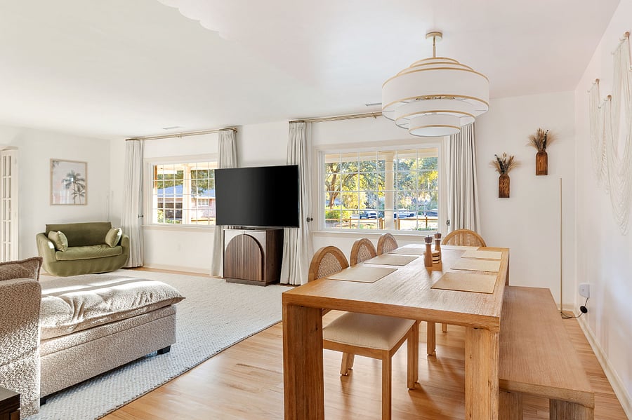 The living and larger dining room is right off the kitchen with enough space for the whole group to relax. Smart tv, home gym weight set and yoga mat and games cabinet provide entertainment for all times of the day.