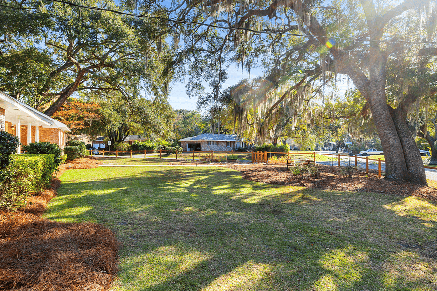 Enjoy the 2 Historic Charleston Oaks in the yard that provide shade and the iconic Spanish moss swaying in the breeze.