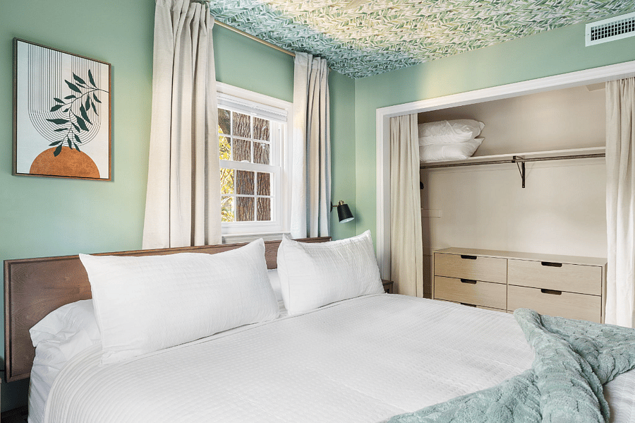 Main level king, which is the room with the desk, has a full closet with a dresser and hangers provided.